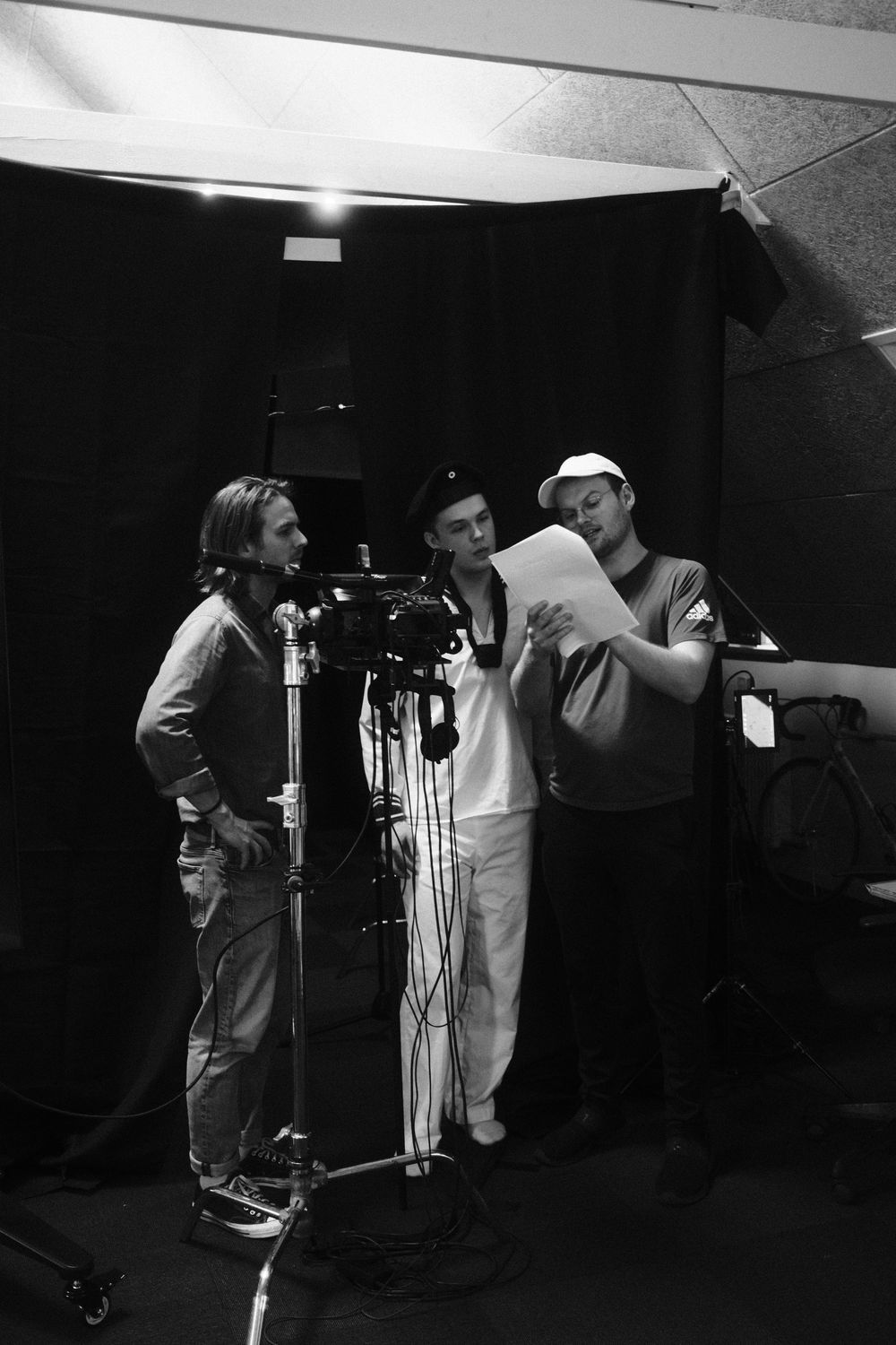 Behind the scenes, three of the crew on set