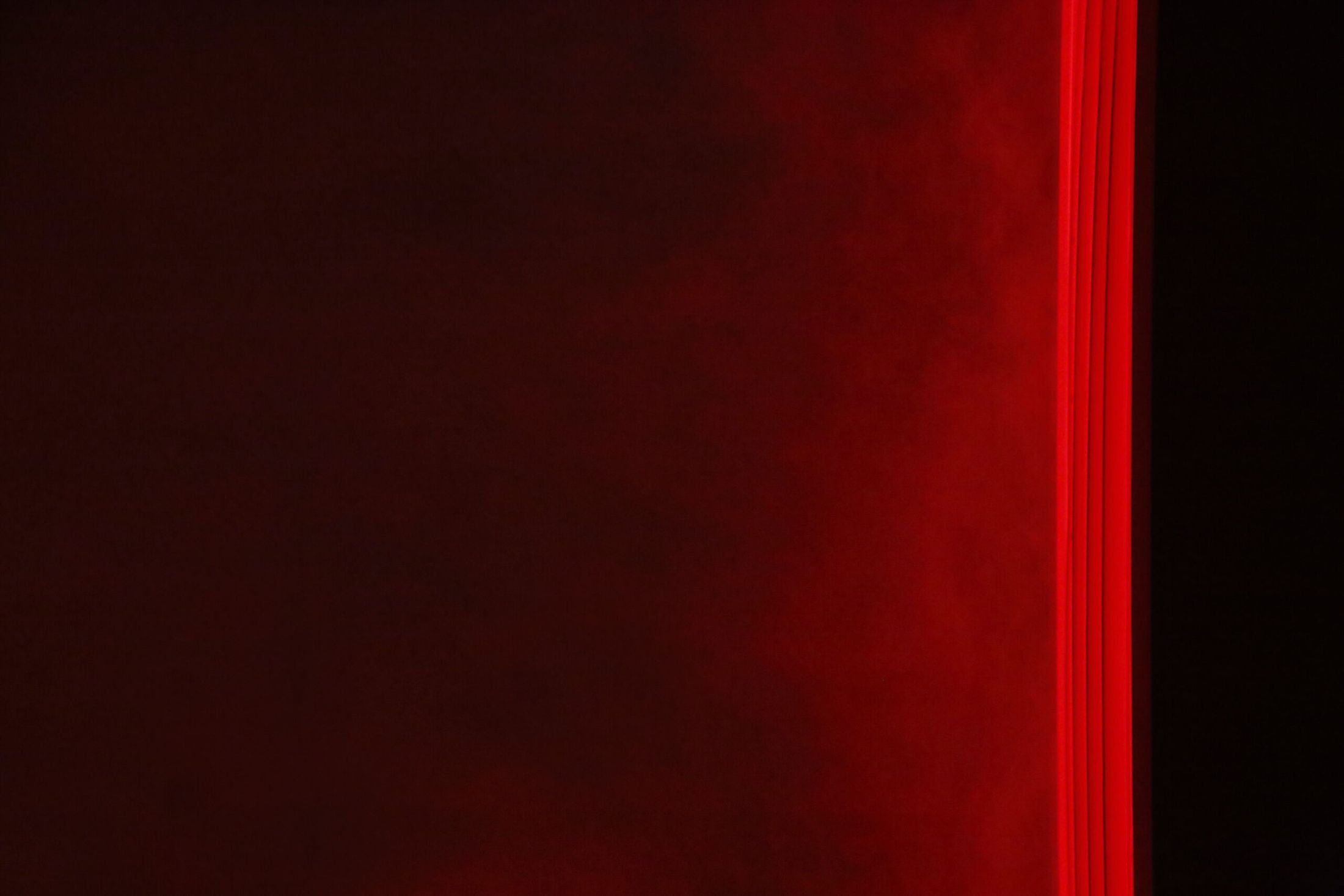 MELT, red light on the wall in close-up