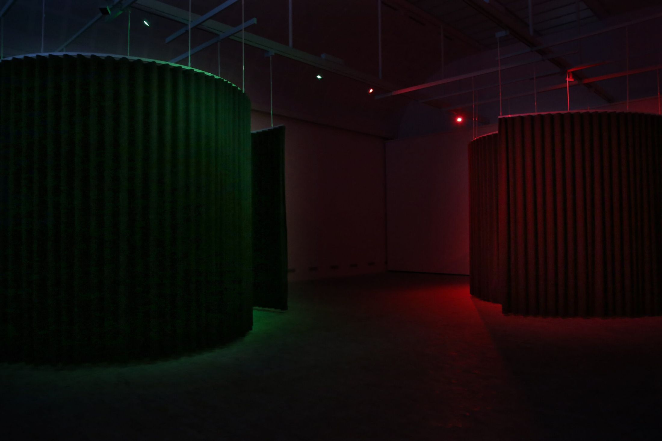 Opus Putesco and Opus Autopsia, the green and red curtained cylinders