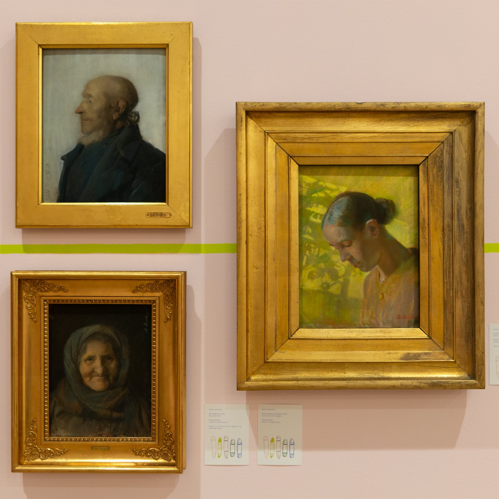 Tegn Amok, portraits in gold frames on the pink wall